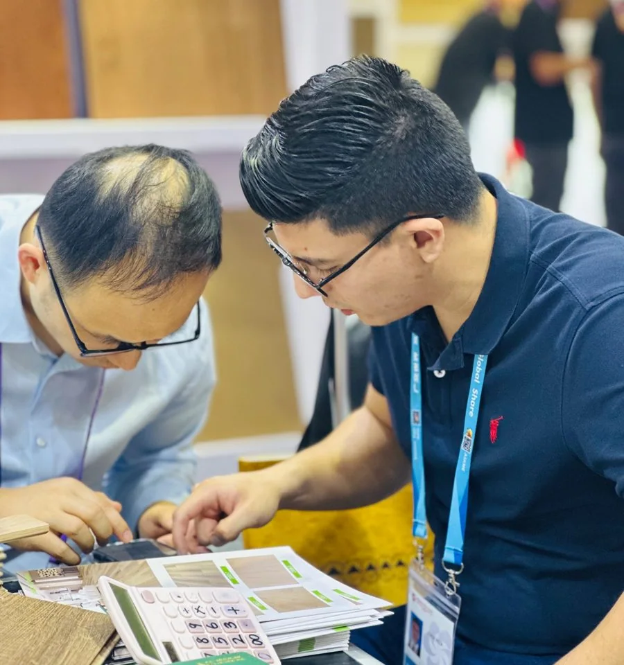 Reviewing product samples with a supplier at Canton Fair
